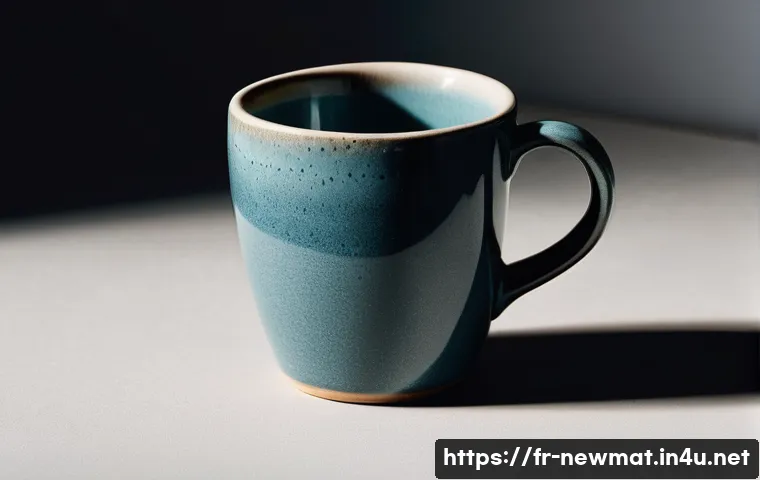 재료의 결함 - **Invisible Flaw: The Ceramic Mug**
    A high-resolution, close-up shot of a broken ceramic mug. Th...