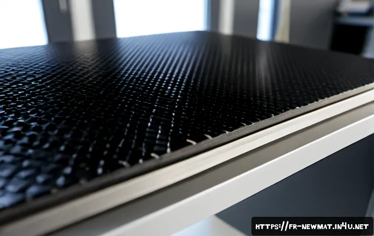 항공 우주 소재 - Photorealistic close-up of advanced aerospace materials on a pristine engineering workbench: layered...